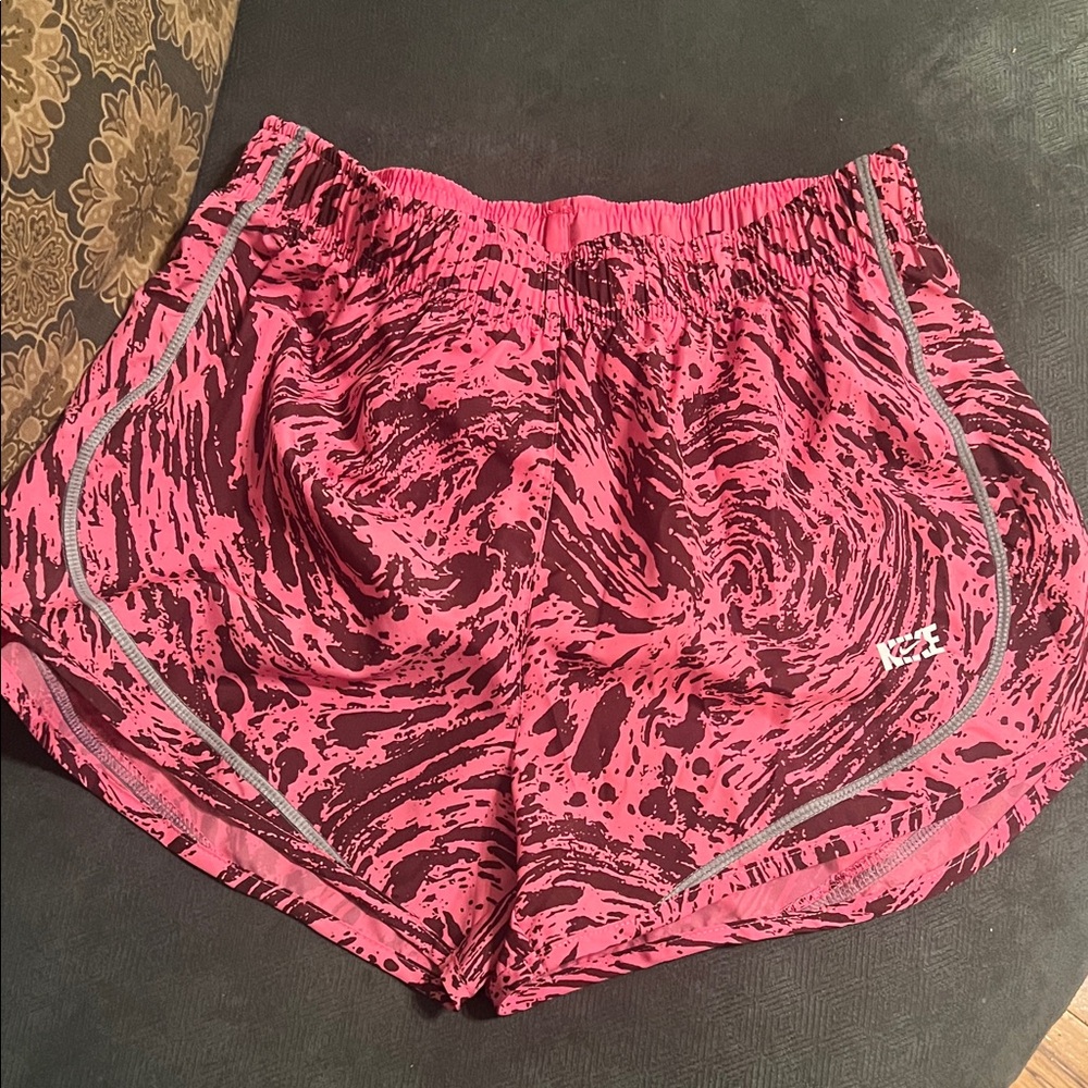 Pink Patterned Shorts by Nike, one small and one XL. NWT . Price is for each!